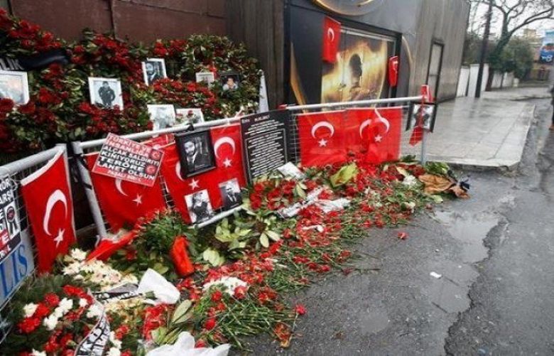 Flowers and pictures of the victims are placed near the entrance of Reina nightclub in Istanbul, Turkey, January 17, 2017.