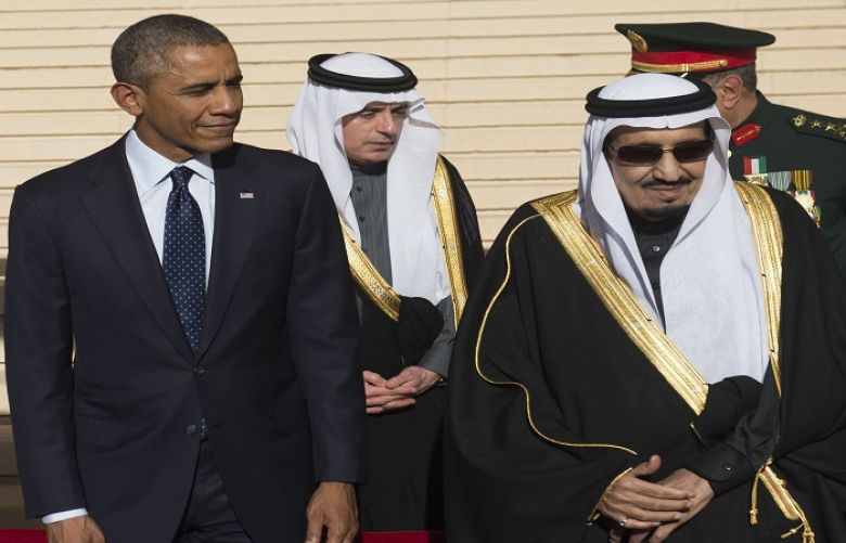 U.S. President Obama and first lady Michelle are greeted by Saudi Arabia&#039;s King Salman as they arrive at King Khalid International Airport in Riyadh.