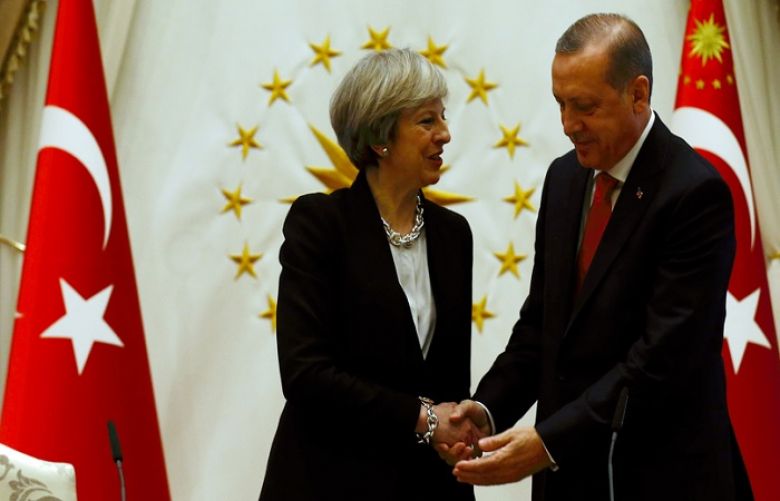 Turkish President Recep Tayyip Erdogan shakes hands with British Prime Minister Theresa May after their meeting at the presidential palace in Ankara, Turkey, Jan. 28, 2017.