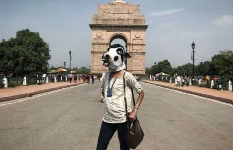Women in India wear masks to prove they’re just as important as cows
