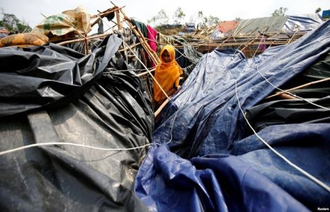 A young Rohingya refugee stands in her house which has been destroyed by Cyclone Mora at Balukhali Refugee Camp in Cox’s Bazar, Bangladesh, May 31, 2017.