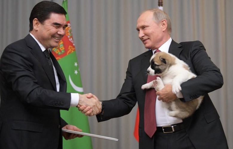 Turkmenistan’s President Gurbanguly Berdymukhamedov, right, smiles as he presents a puppy to Russian President Vladimir Putin during their meeting in the Bocharov Ruchei residence in the Black Sea resort of Sochi, Russia, Wednesday, Oct. 11, 2017. The presidents met on the sidelines of a summit of leaders of ex-Soviet nations in Sochi.