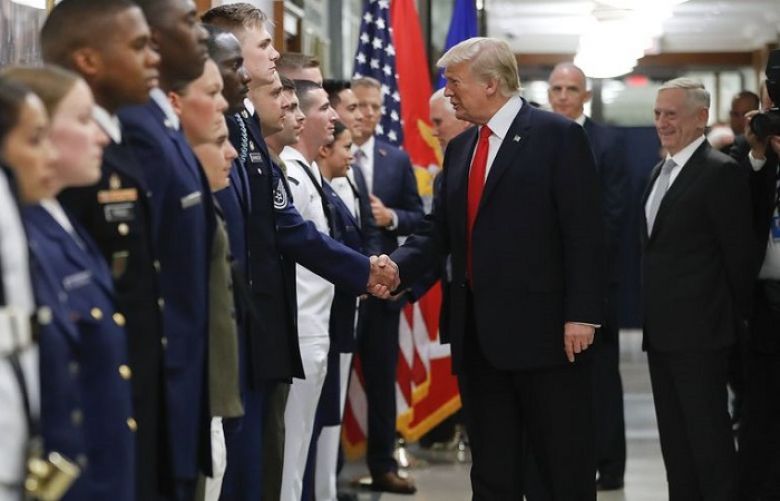 President Donald Trump and Vice President Mike Pence greet military personnel during their visit to the Pentagon, Thursday,July 20, 2017. Looking on is Defense Secretary Jim Mattis, right.