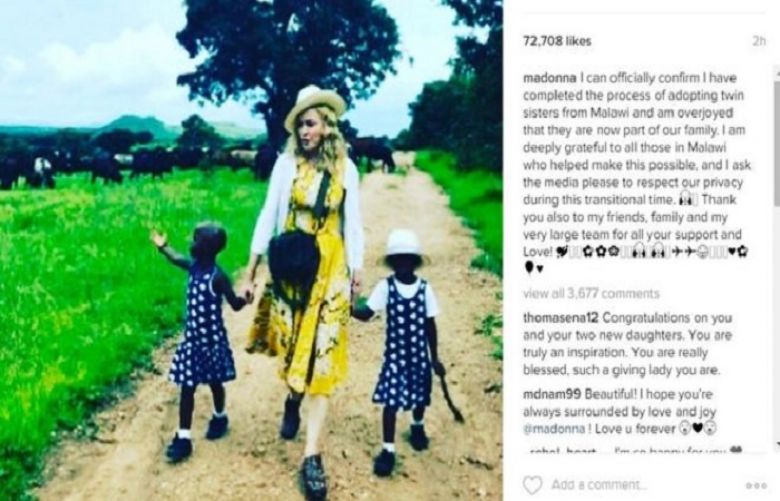 Madonna posted confirmation of the adoption on Instagram - with this picture of her and the twins