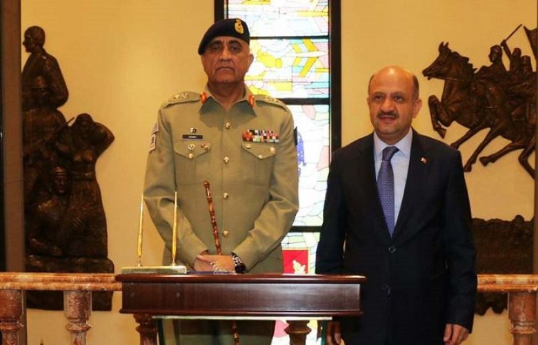 Chief of Army Staff Gen Qamar Javed Bajwa (L) with Turkish Defence Minister Fikri Isik (R).