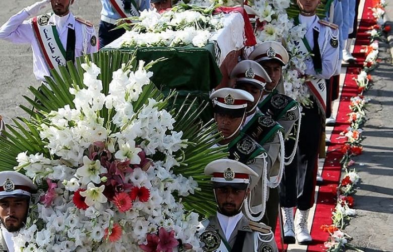 The Iranian honour guard carries the caskets of Iranian pilgrims