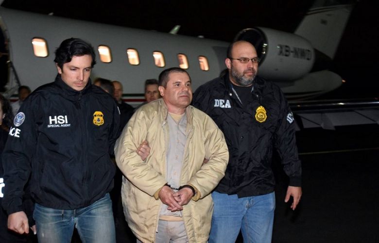 Authorities escort Joaquín ‘El Chapo’ Guzmán from a plane at Long Island MacArthur Airport in Ronkonkoma, N.Y., on Thursday, in this photo provided U.S. law enforcement.