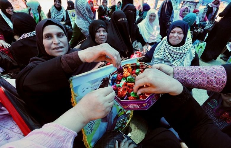 Palestinians in Gaza City celebrate after hundreds of Palestinian political prisoners in Israeli jails suspended a 40-day hunger strike on 27 May.