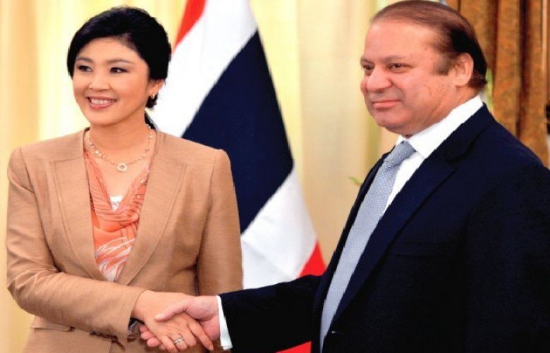 Prime Minister Nawaz Sharif shaking hands with his Thai counterpart Yingluck Shinawatra
