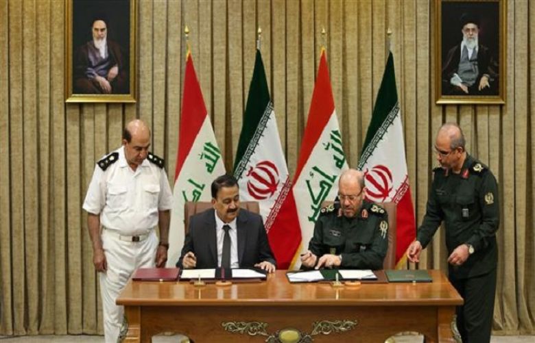 Iranian Defense Minister Brigadier General Hossein Dehqan and his Iraqi counterpart, Erfan al-Hiyali, 