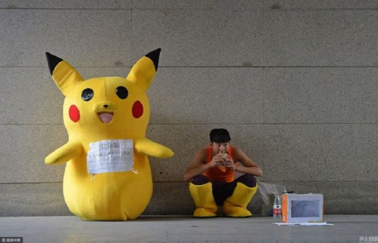 Young father dresses up as Pikachu