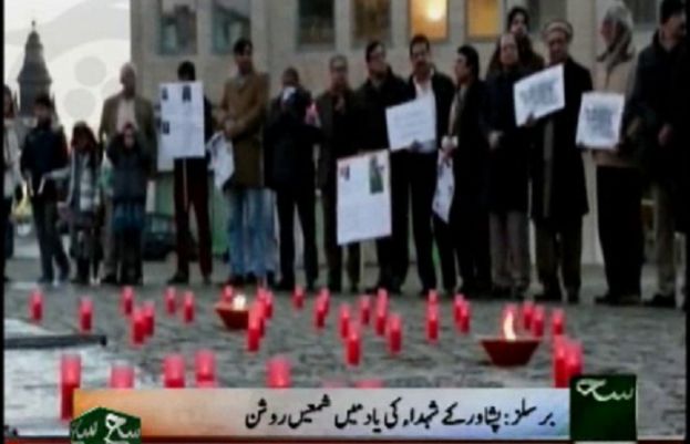 Lit candles in memory of the martyrs of Peshawar in Brussels