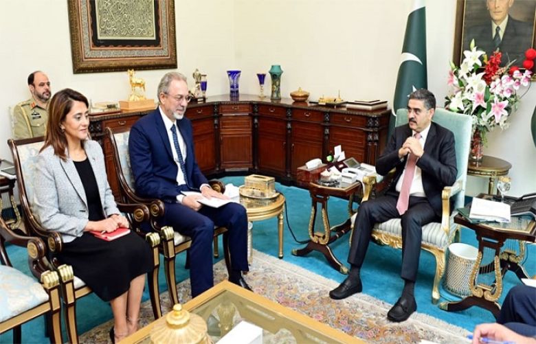 Caretaker Prime Minister Anwaar-ul-Haq Kakar talking to Ambassador of Turkiye Mehmet Pacaci
