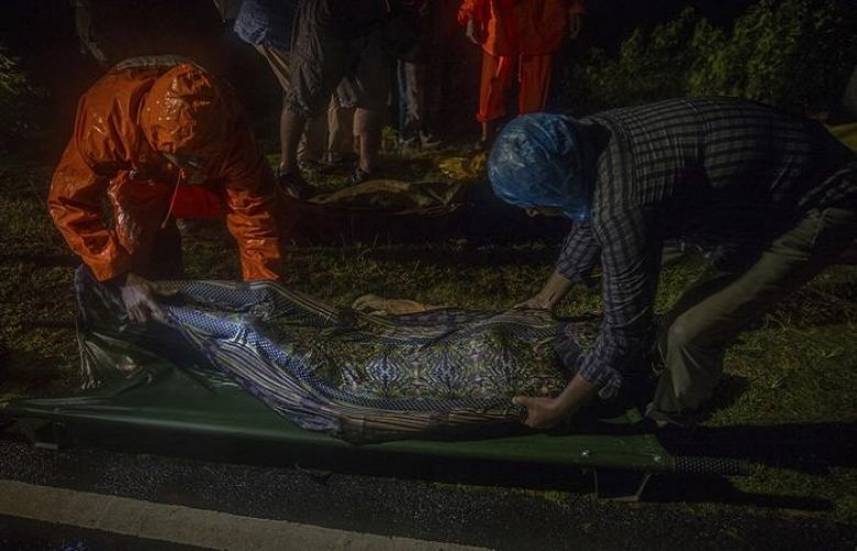 Rescue workers carry body of a Rohingya Muslim, who died after their boat capsized in the Bay of Bengal.