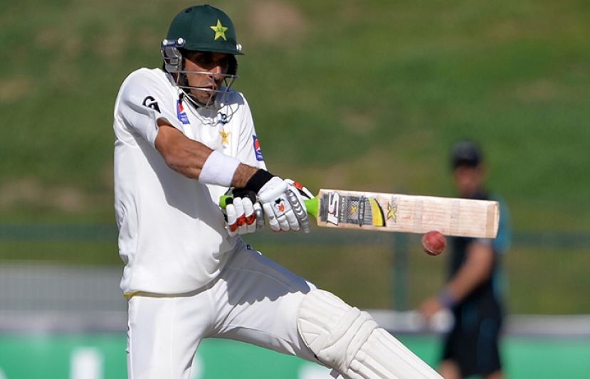 Misbah-ul-Haq playing a reverse sweep shot during the first Test match against New Zealand in Abu Dhabi.