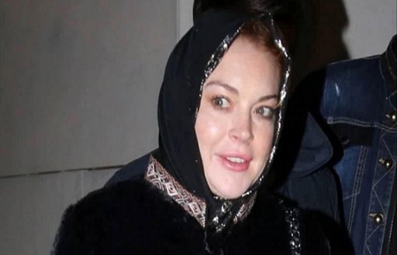 Lindsay Lohan claims she was “racially profiled” while wearing a headscarf at London’s Heathrow Airport.