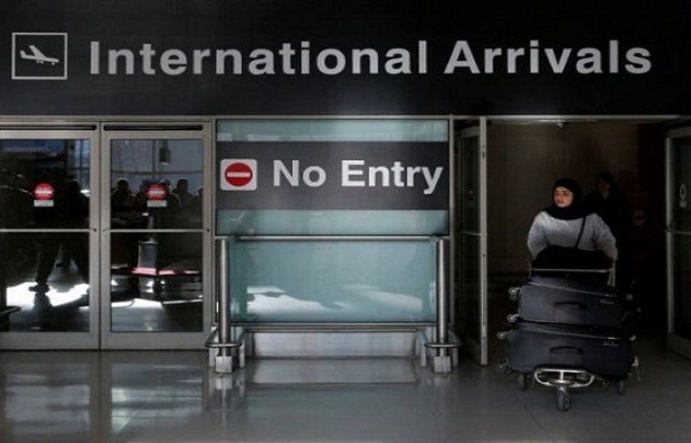 An international traveler arrives after US President Donald Trump&#039;s executive order travel ban at Logan Airport in Boston, Massachusetts, US.