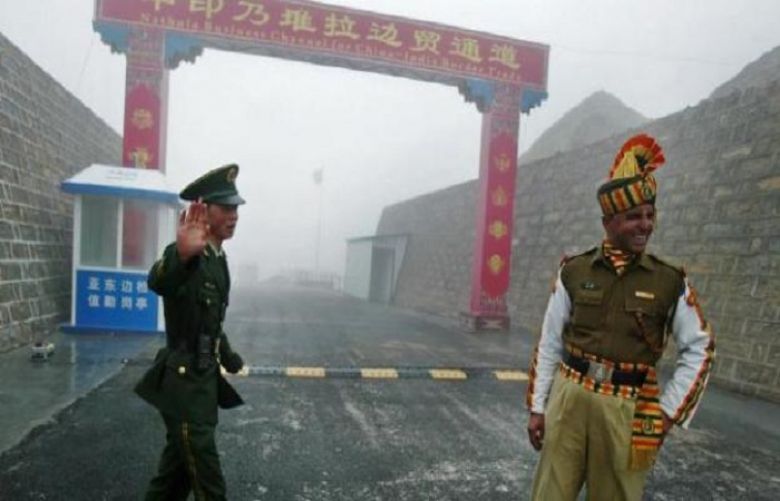 A Chinese and Indian soldier at the Nathu La border crossing between India and China in India’s northeastern Sikkim state. 