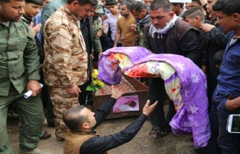 Iraqis bury three-year-old Fatima Samir, who died after a chemical attack by the Islamic State group on the town of Taza, south of Kirkuk, on March 11, 2016