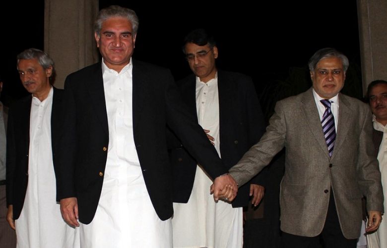PMLN leader and Finance Minister Senator Ishaq Dar along with PTI leader Shah Mehmood Qureshi, coming out after press conference at Punjab House.