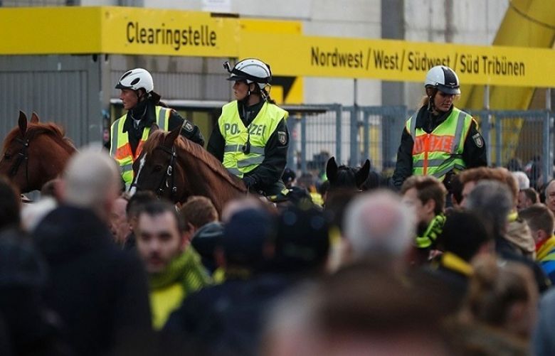 Police patrol on horseback outside the stadium.