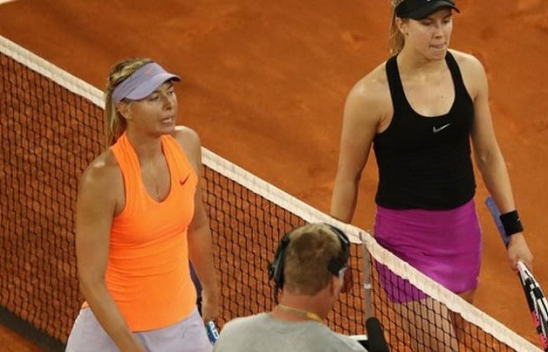 Maria Sharapova was defeated by Eugenie Bouchard in a marathon three-setter in the second round of the Madrid Open on Monday