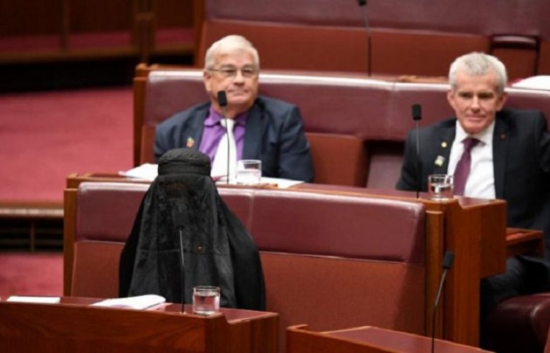 Australia&#039;s Hanson wears burqa to parliament in bid to ban them