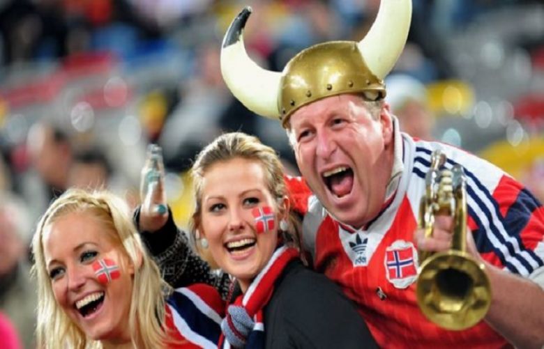 Happy Norwegian fans at an international football game in 2009