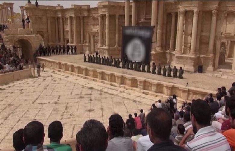 The screenshot taken from an ISIL video released on July 4, 2015, purportedly shows 25 Syrian soldiers being executed by the terrorists in Palmyra, Syria.