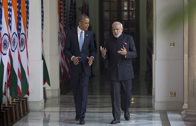 US President Barack Obama walks with Indian Prime Minister Narendra Modi at the Hyderabad House in New Delhi, India.