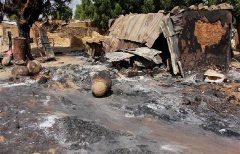 A picture taken on December 17, 2018 shows mud houses burnt down by Boko Haram Islamists fighters in the Maiborti village, on the outskirts of Maiduguri, northeast Nigeria, on December 17, 2018. 