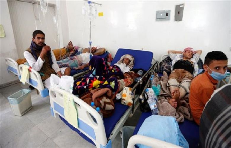 Yemeni men suspected of being infected with cholera receive treatment at a hospital in Sana&#039;a on May 12, 2017.