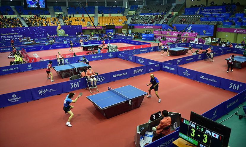 A general view shows athletes playing table tennis matches in the team preliminary round table tennis event during the 2014 Asian Games at Suwon Gymnasium in Suwon, outside Incheon, on September 27, 2014.