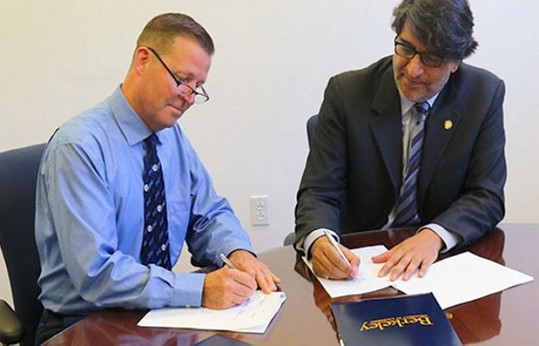 Officials of UC Berkeley and Habib University signing the MoU.