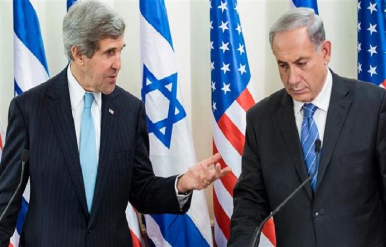 Israeli Prime Minister Benjamin Netanyahu listens as US Secretary of State John Kerry makes a statement to the press before a meeting at the prime minister&#039;s office on January 2, 2014.