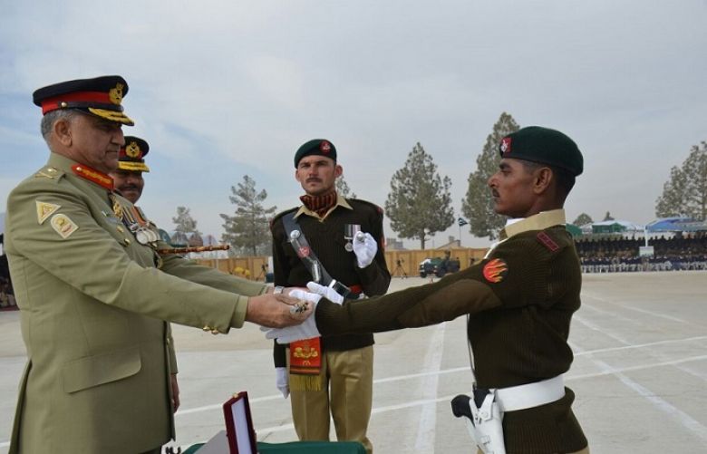 COAS General Qamar Javed Bajwa awarding COAS cane to outstanding recruit Ehsan Ali on passing out