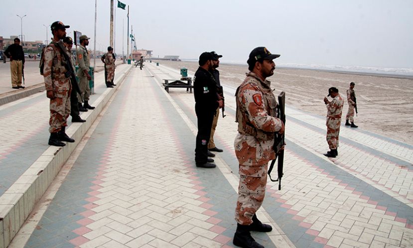 Troops of the Pakistani security forces stand guard at Cliften beach in Karachi, Pakistan, Thursday, Oct. 30, 2014. According to the country&#039;s meteorological office, the hurricane Nilofar is losing its strength and it will cause heavy rains in Pakistani coastal areas.