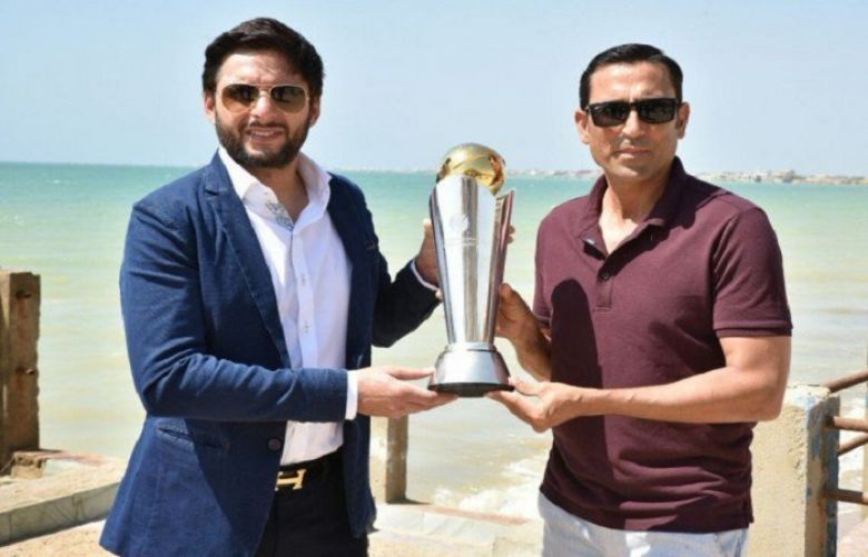 Shahid Afridi and Younas Khan holding Champions Trophy 2017