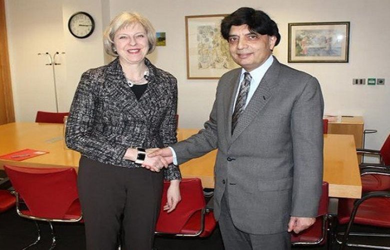 Britain’s Prime Minister Theresa and Interior Chaudhry Nisar Ali Khan