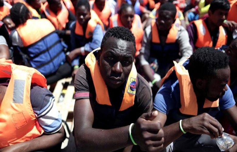Migrants are seen in the MOAS rescue vessel Phoenix during a rescue operation in the international waters off Libya