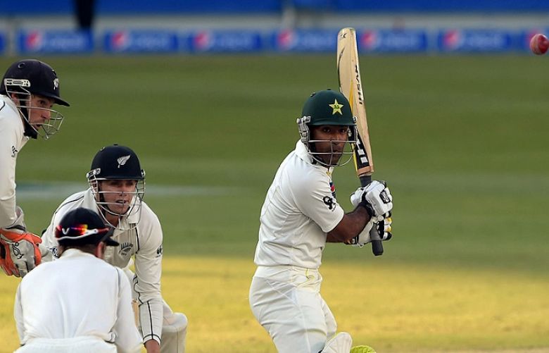 Pakistani batsman Asad Shafiq (R) cuts en route his unbeaten 41.