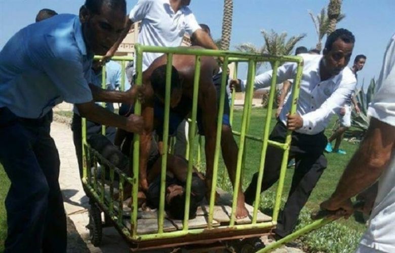 Photo showing the attacker held in an iron cage. 