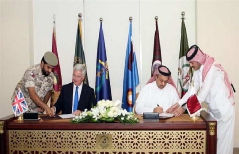  British Defense Secretary Michael Fallon and his Qatari opposite number Khalid bin Mohammed al-Attiyah