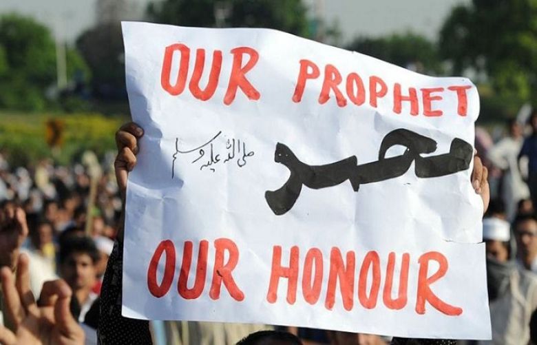 &#039;Our Prophet Muhammad (PBUH), Our Honour,’ could be seen at a rally in Islamabad