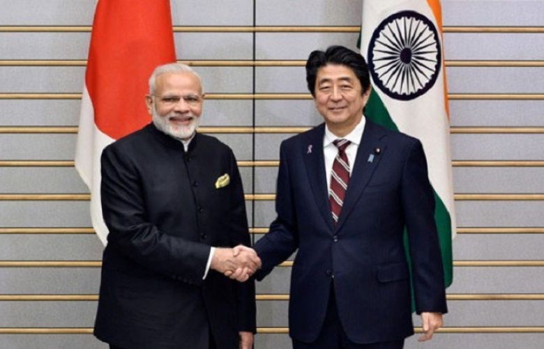 India&#039;s Prime Minister Narendra Modi (L) shakes hands with his Japanese counterpart Shinzo Abe at the start of their meeting at Abe&#039;s official residence in Tokyo on November 11, 2016.