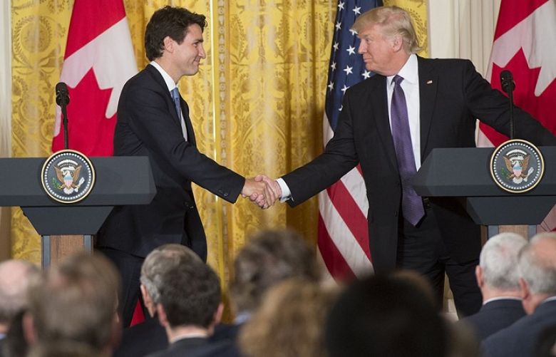 Canadian Premier Justin Trudeau shaking hand with US President Donlad J. Trump