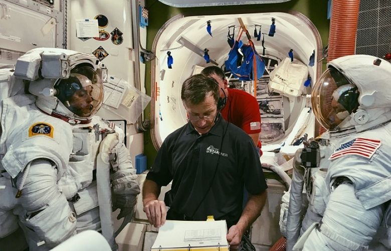 In this February 2019 photo made available by NASA and Boeing, Boeing astronaut Chris Ferguson helps NASA astronauts Nicole Mann, left, and Mike Fincke, right, train for a spacewalk inside the International Space Station Airlock Mockup at NASA&#039;s Johnson Space Center in Houston. The three are assigned to Boeing&#039;s Crew Flight Test, Starliner&#039;s first flight with crew as part of NASA&#039;s Commercial Crew Program. The Starliner capsule, supposed to make its debut in April 2019, was pushed back until August. 