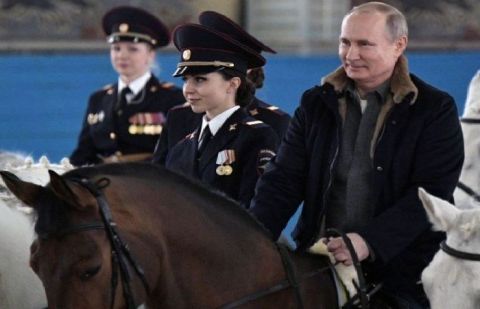 Russia&#039;s Putin rides horse with female police ahead of International Women&#039;s Day