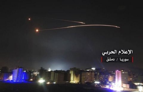 Syrian air defense systems intercept Israeli missiles in the skies near Damascus late on December 25, 2018. 