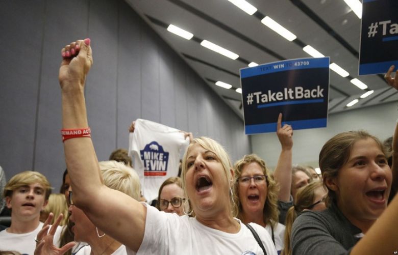 Supporters at a Take It Back California event where former President Barack Obama campaigns in in support of California congressional candidates, Sept. 8, 2018, in Anaheim, Calif.